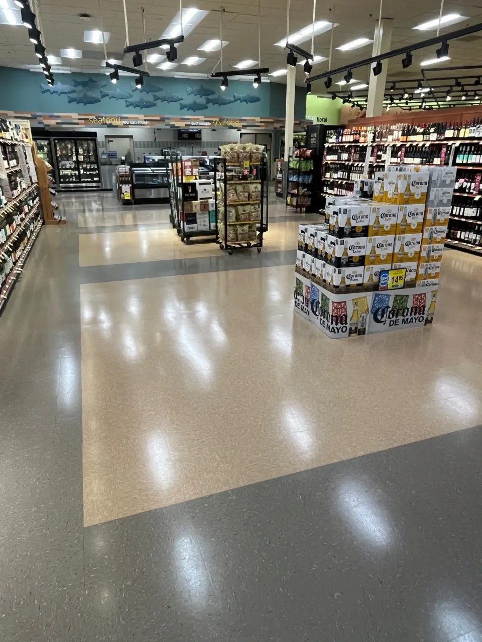 Finished grocery store floor with polished tile and stocked aisles