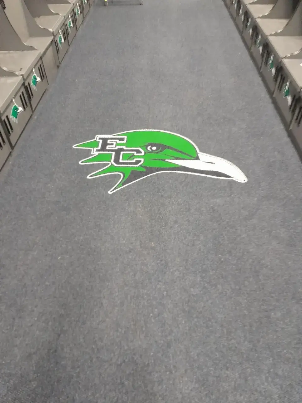 School logo inset into grey broadloom carpet