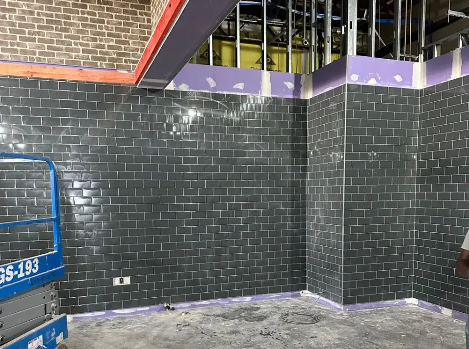 Subway tile installed on a wall