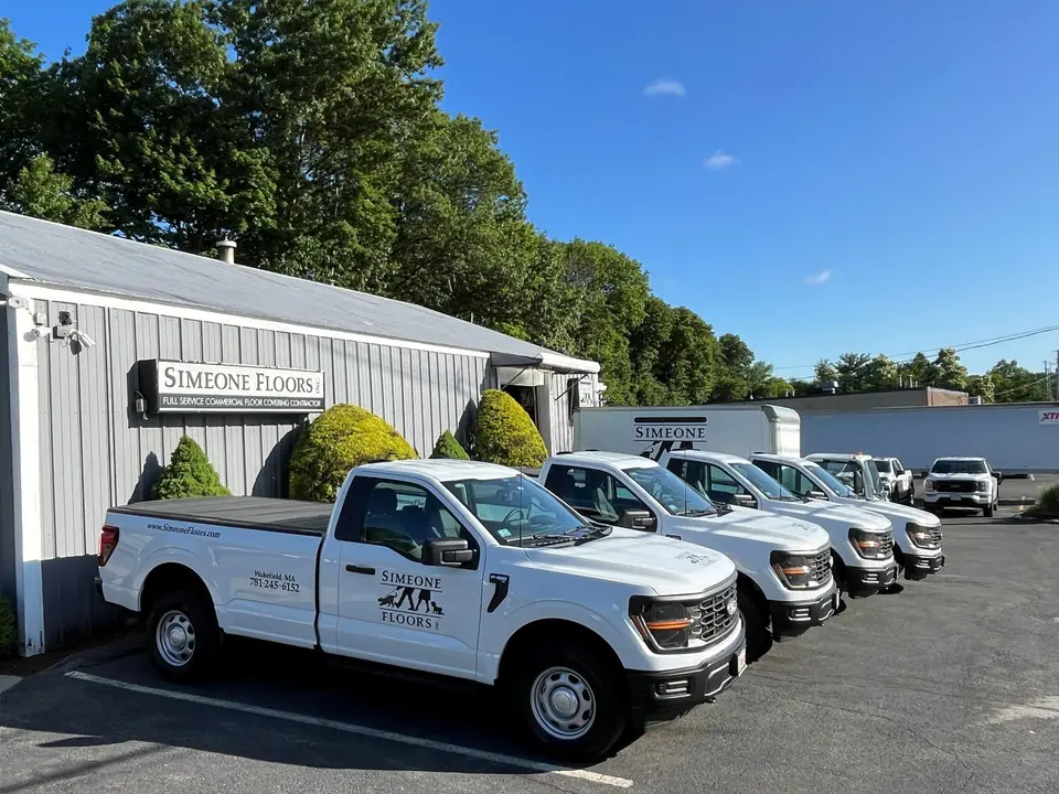 Simeone Floors trucks parked outside the office at 12 New Salem Street, Wakefield
